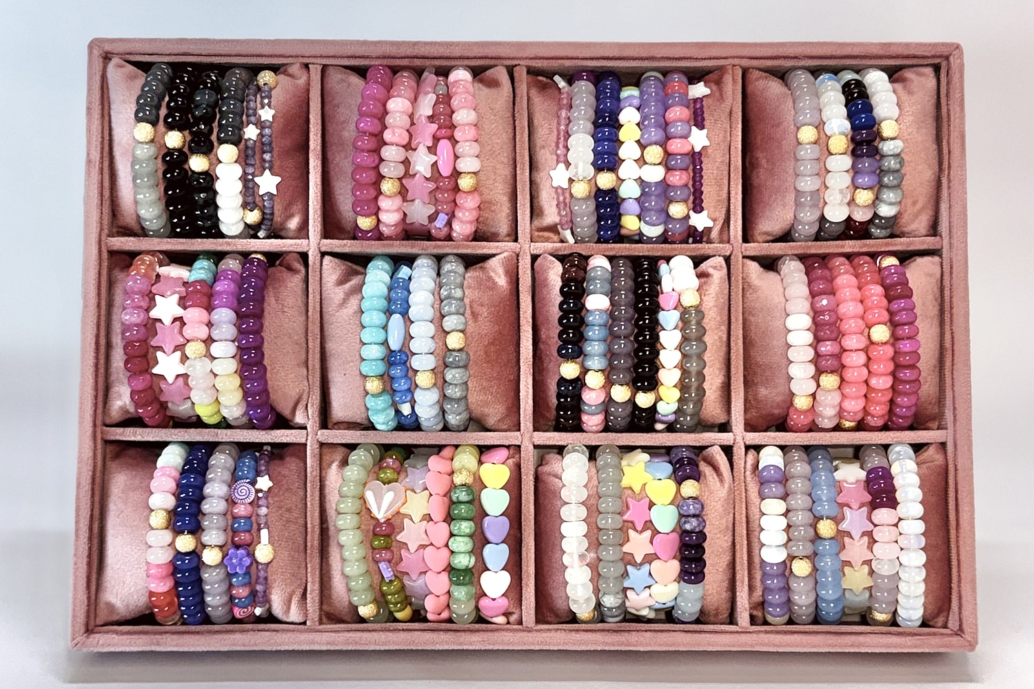 Colorful beaded bracelets arranged in a display.