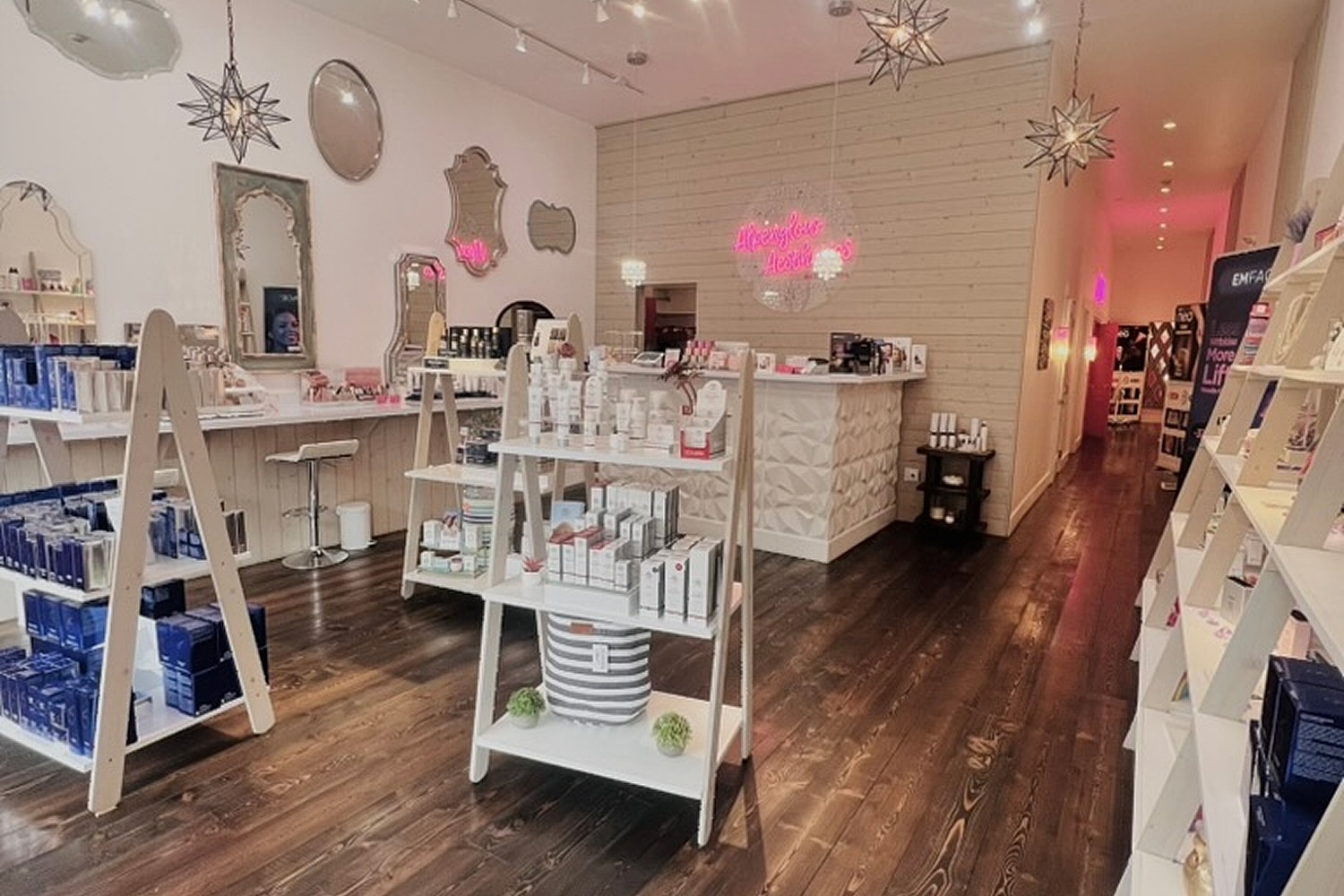 Skin care treatment room with pink accents.