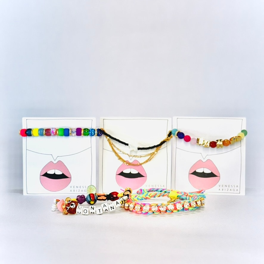 Colorful jewelry displayed on artistic packaging.