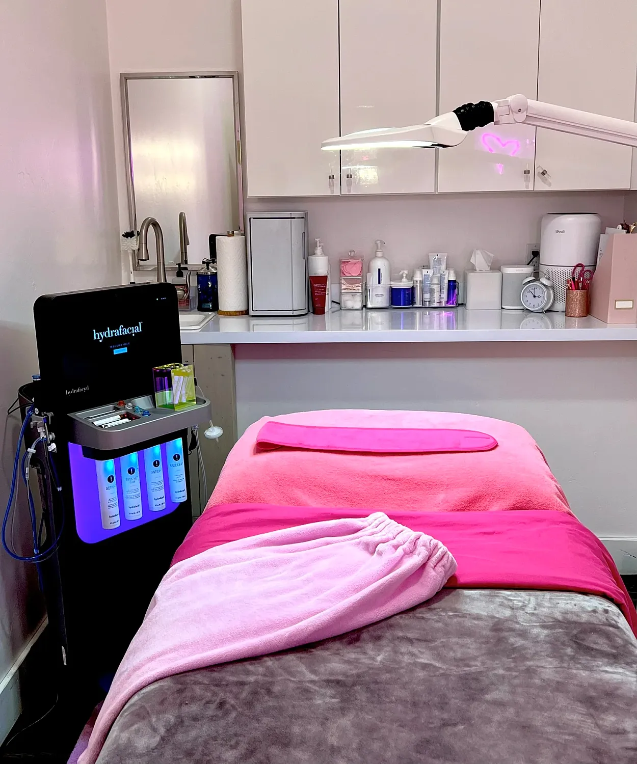 Spa treatment room with hydrafacial equipment.