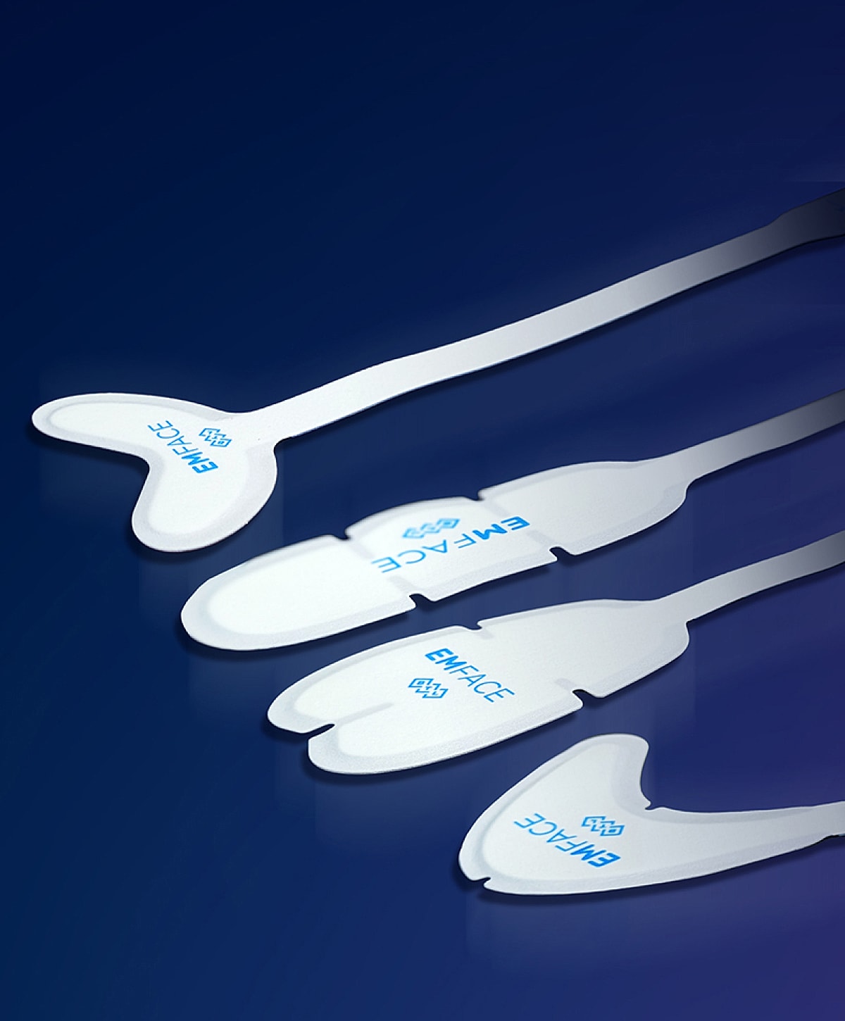 EMFACE treatment applicators on a blue background