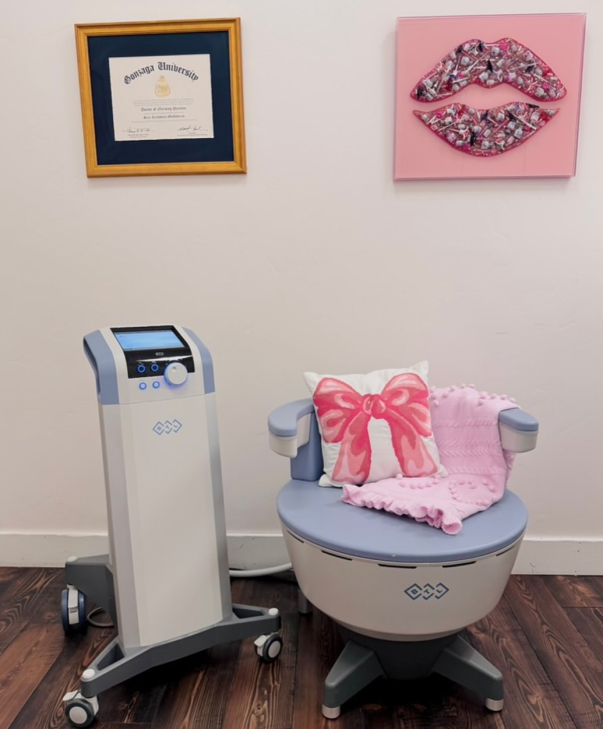 Cosmetic treatment room with equipment and decor.