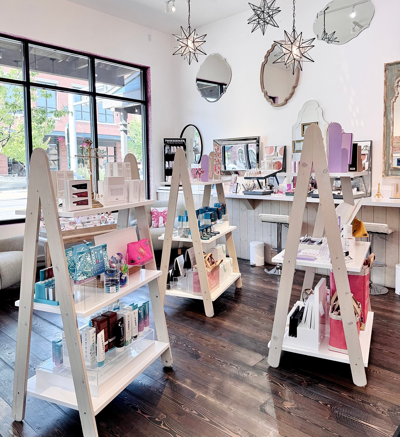 Cosmetic store display with shelves and products.