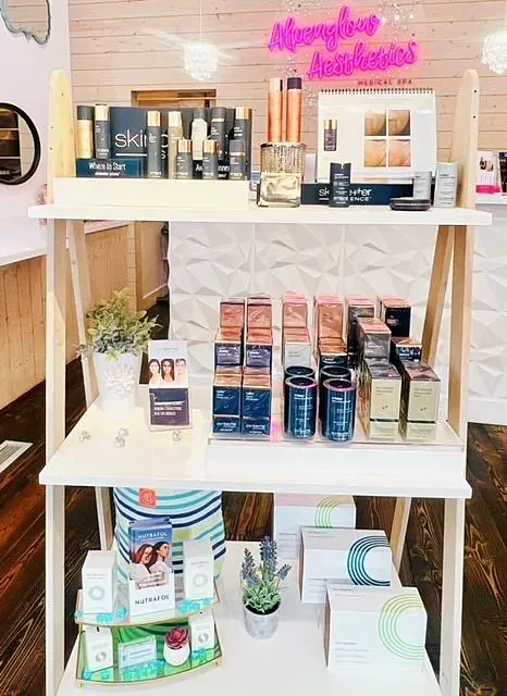 Aesthetic products displayed on wooden shelf.