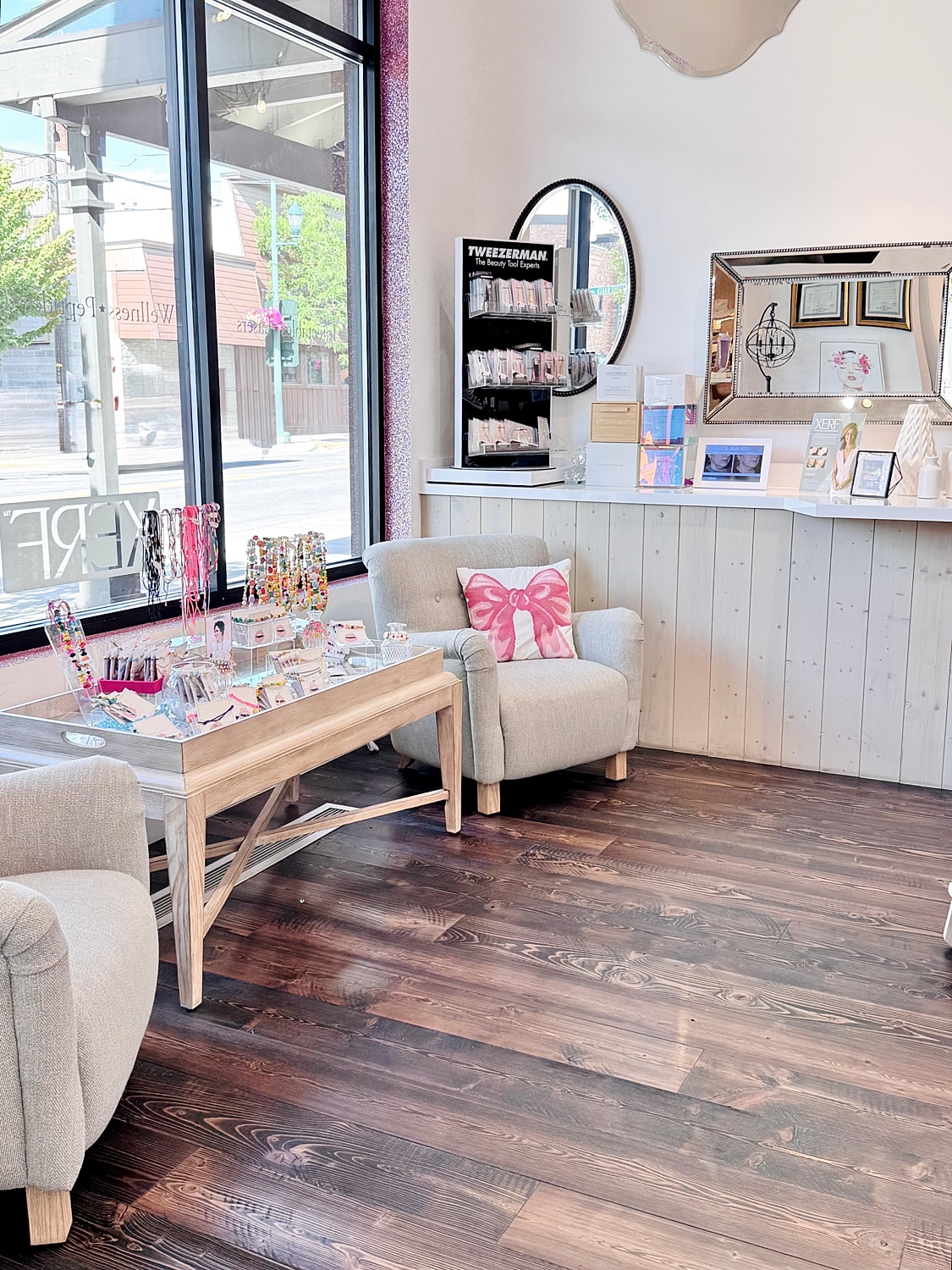 Cozy beauty salon interior with seating area.