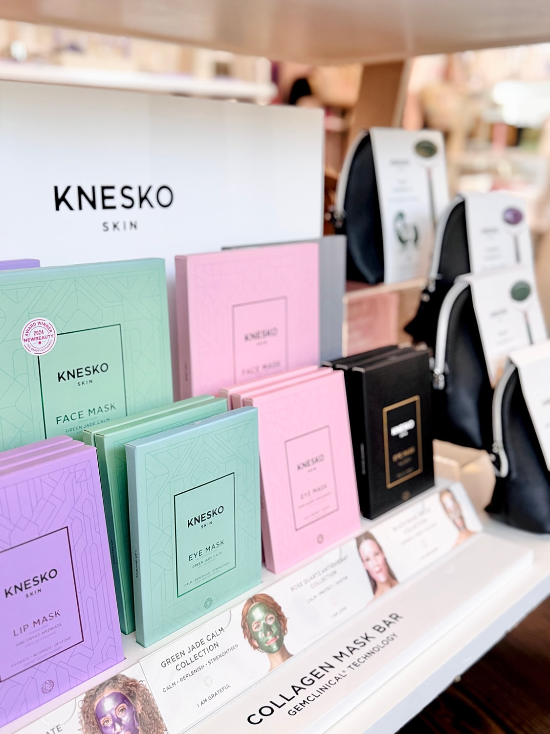 Knesko skin care masks display on shelf.