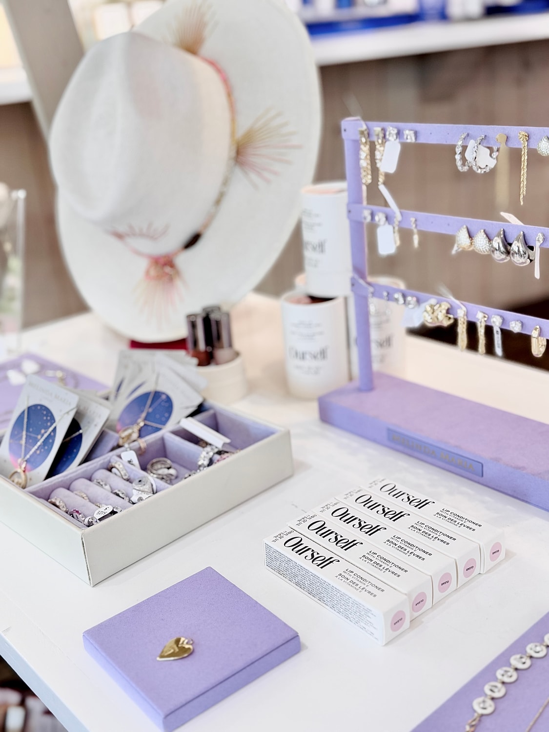 Jewelry display with accessories and beauty products.