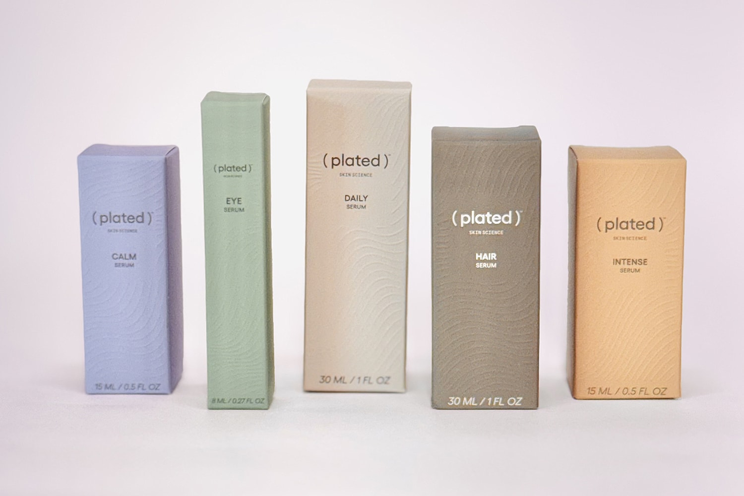 Skincare serums in stylish eco-friendly packaging.
