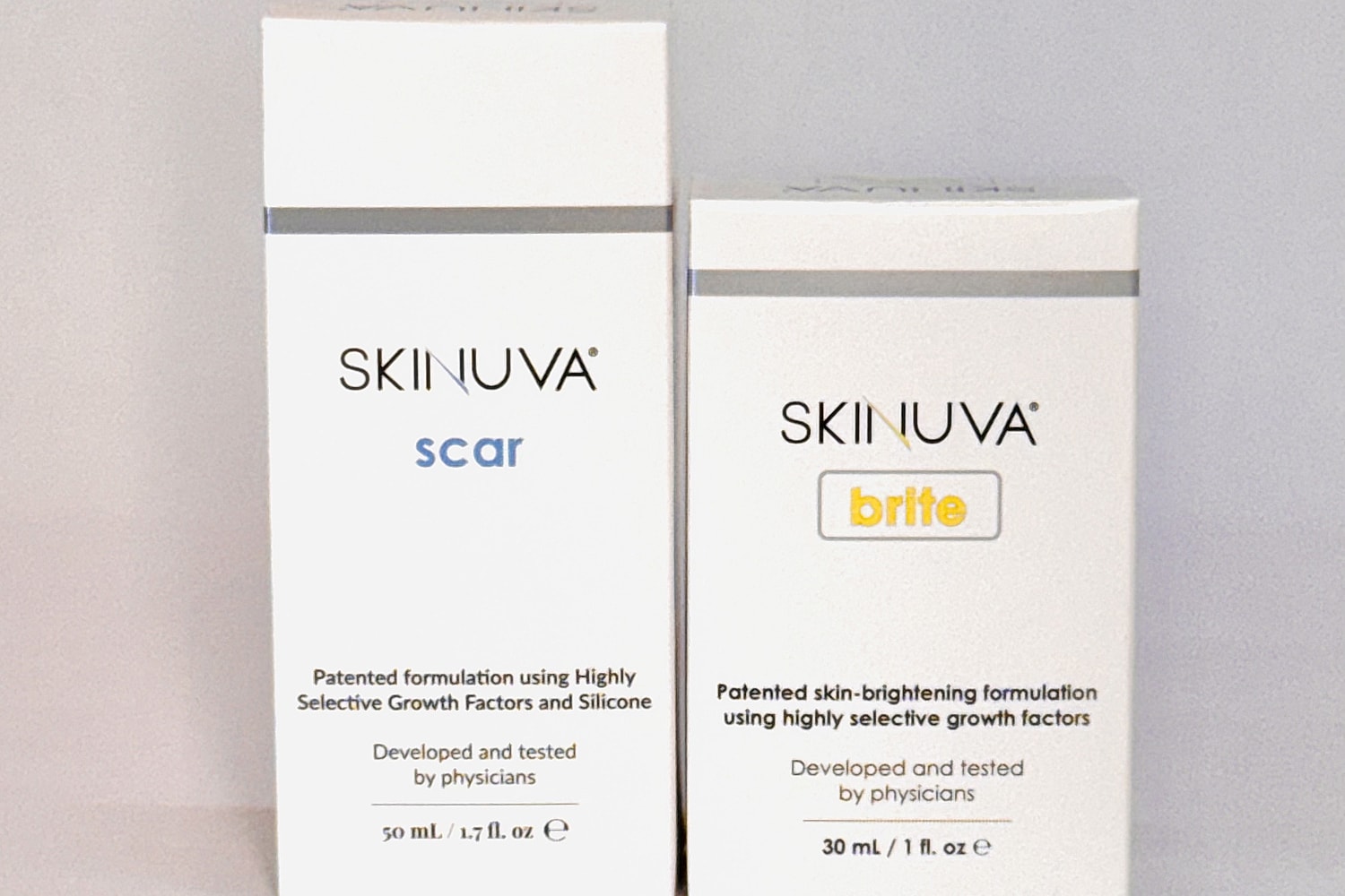 Skinuva scar and brite packaging displayed together.