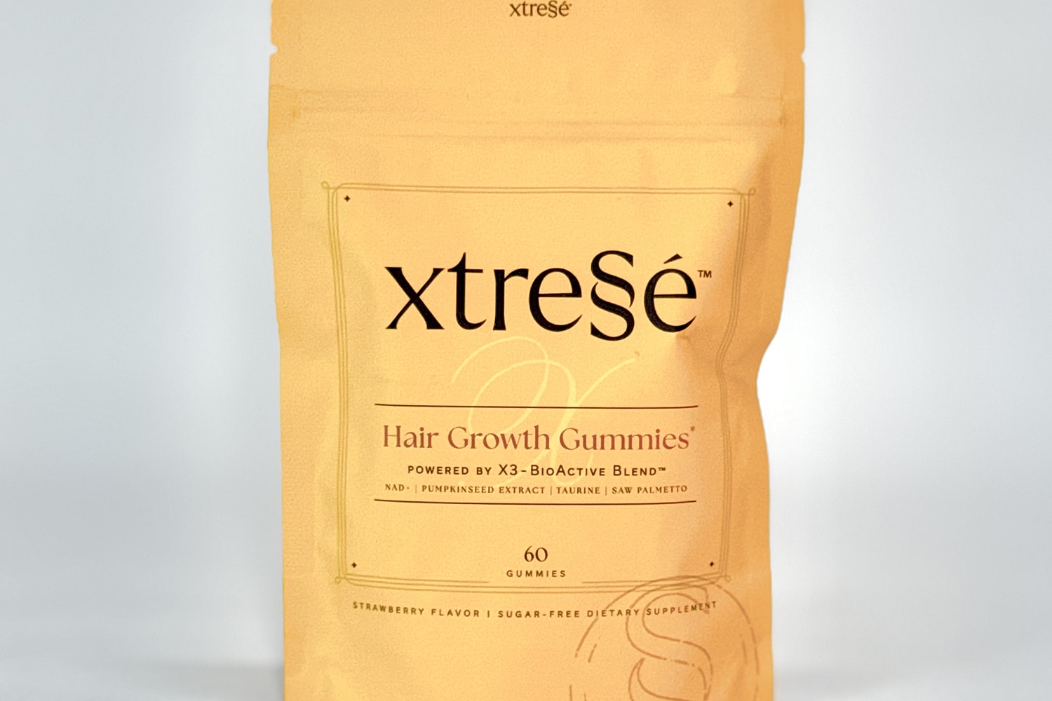 Hair growth gummies in strawberry flavor, dietary supplement.