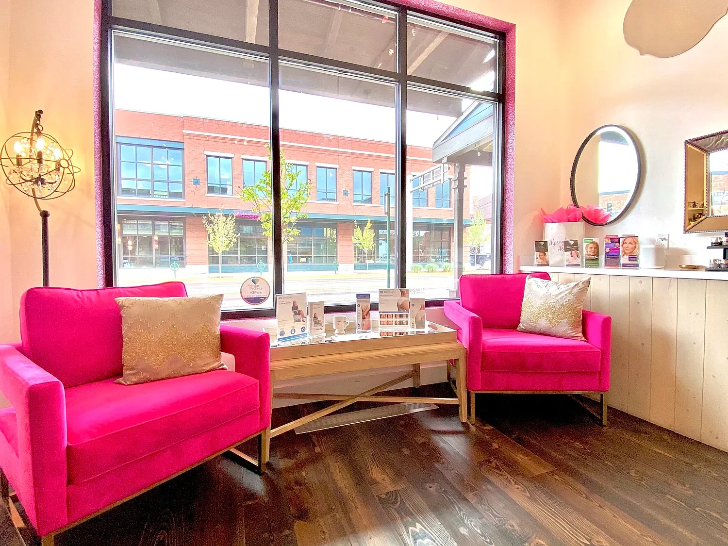 Bright salon interior with pink seating and decor.