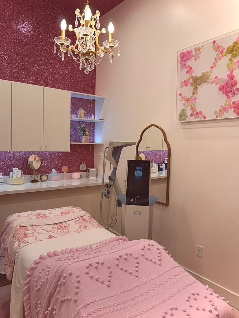 Two women posing in a boutique setting.