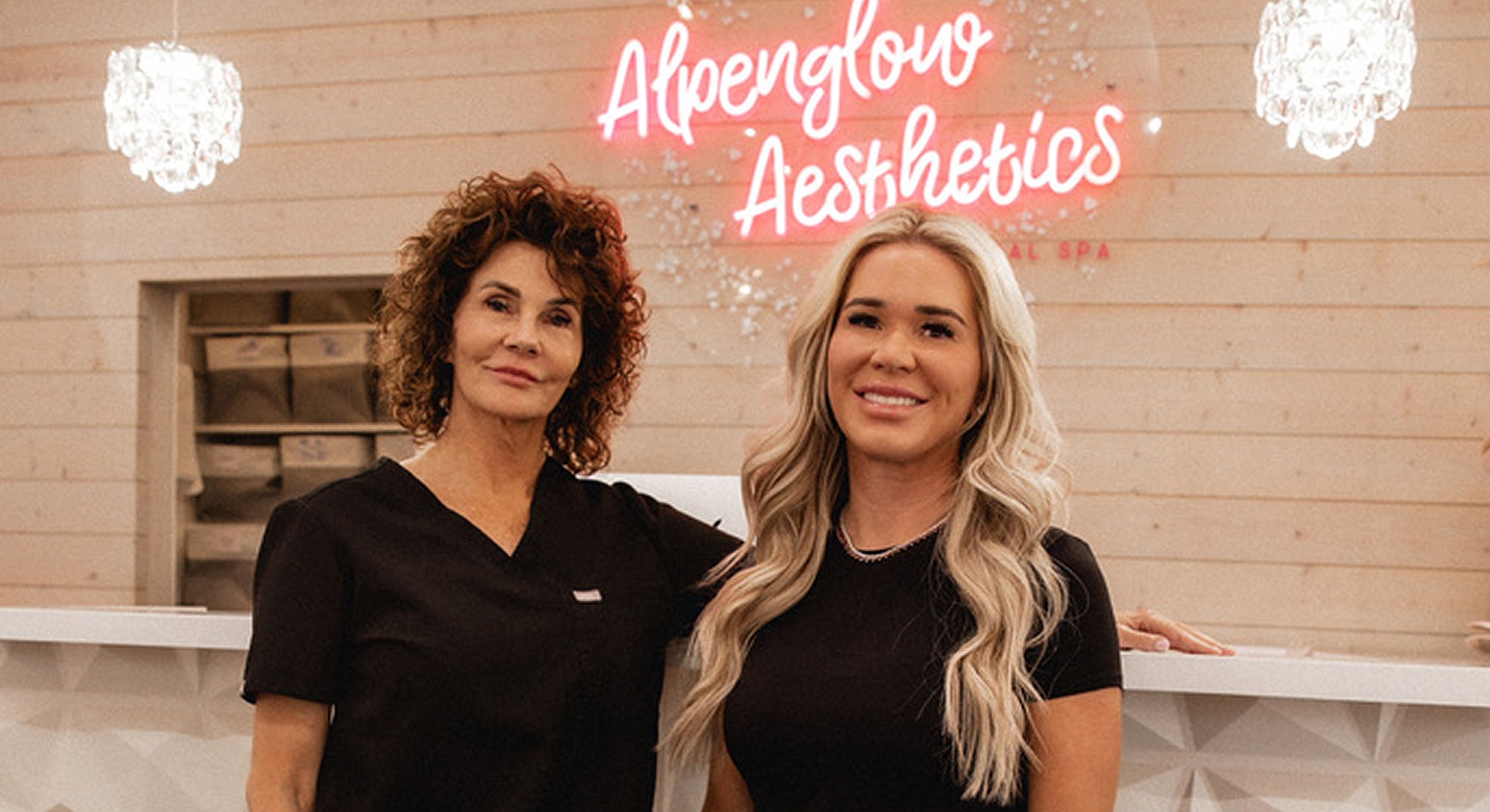 Aestheticians posing in a modern spa environment