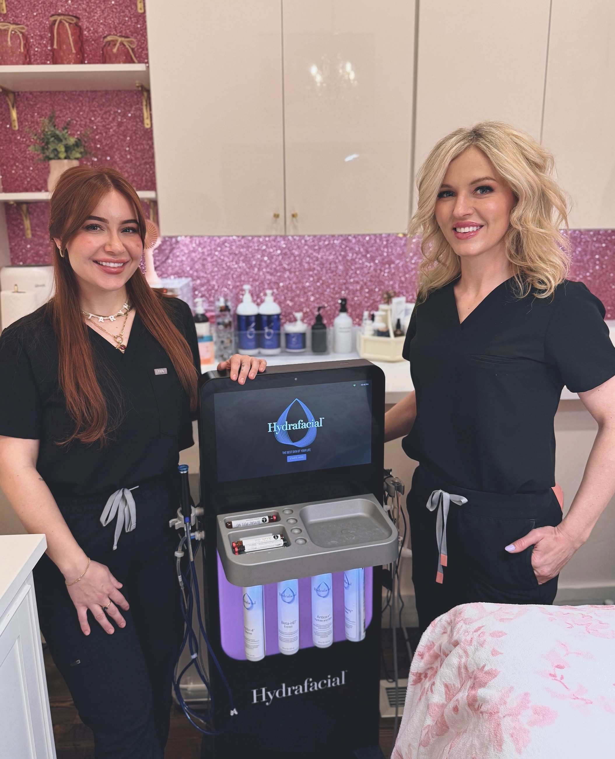 Hydrafacial team in a beauty salon setting.