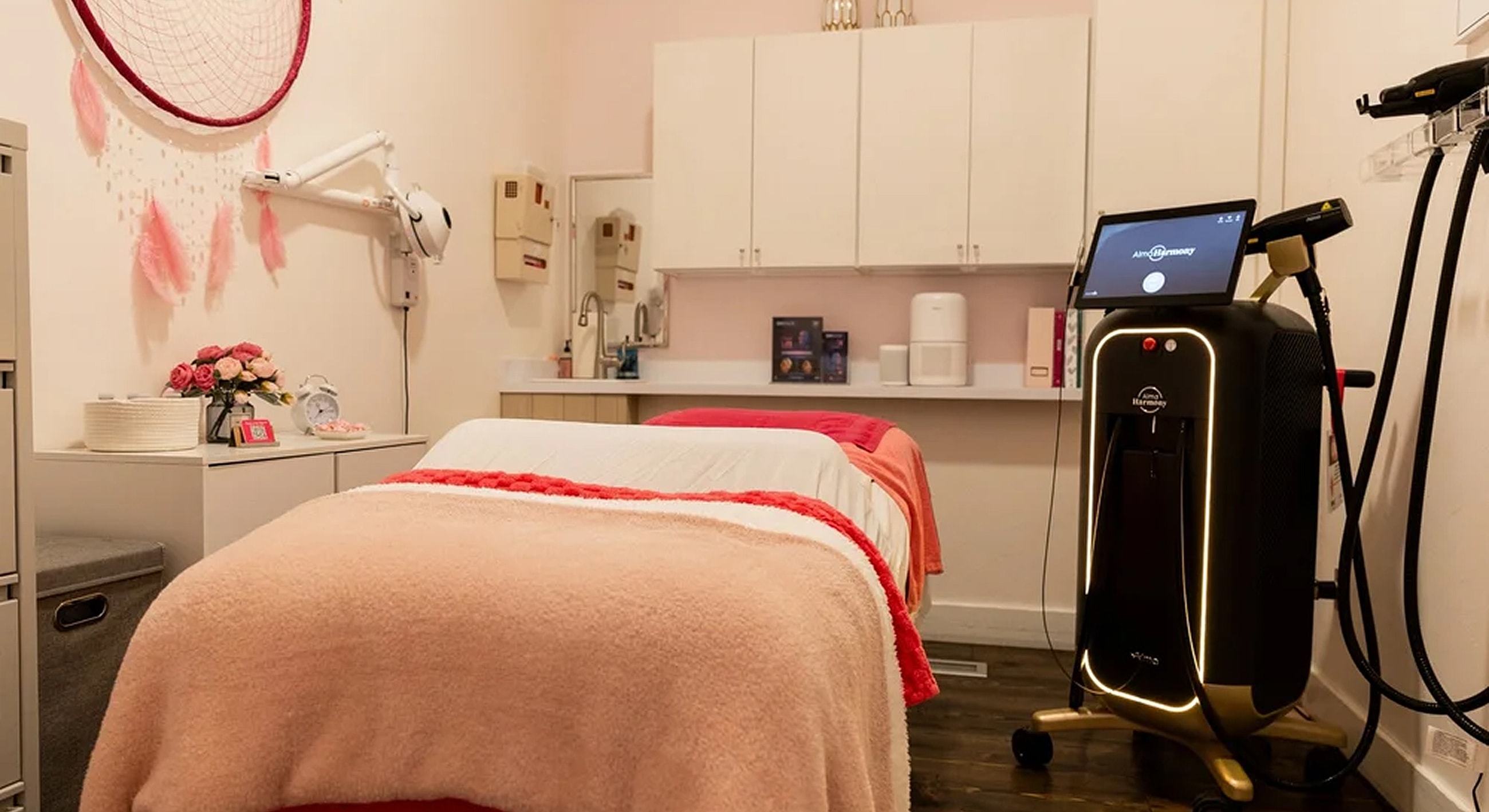 Alpenglow Aesthetics treatment room with massage tables and equipment.