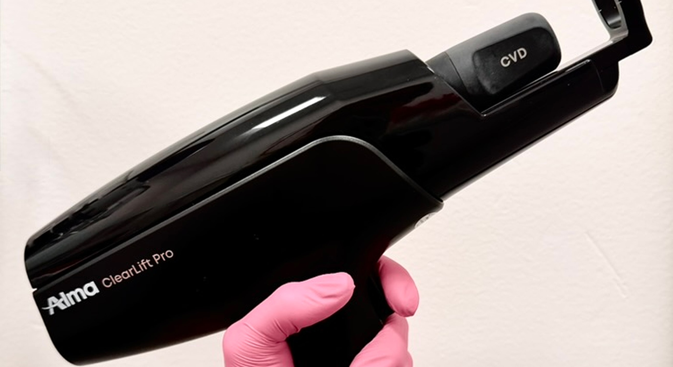 Black handheld device for skin treatment.