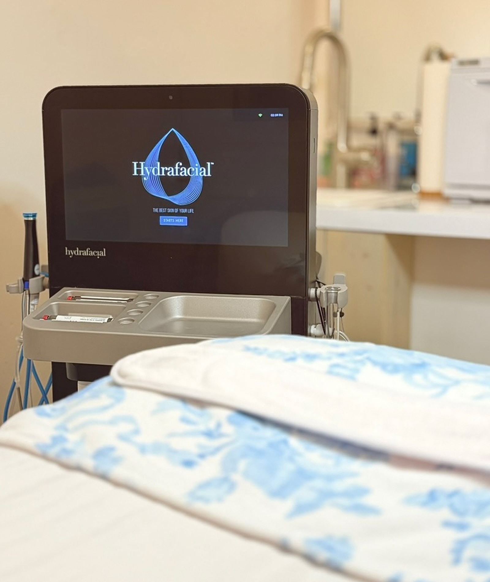 Hydrafacial machine in a treatment room.